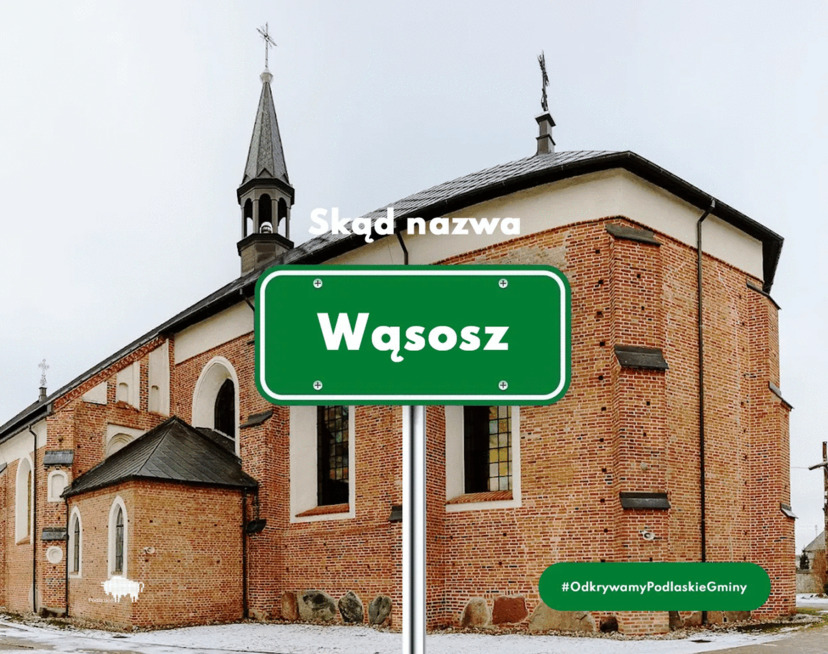 Kościół w Wąsoszu i widoczna tabliczka z nazwą miasta